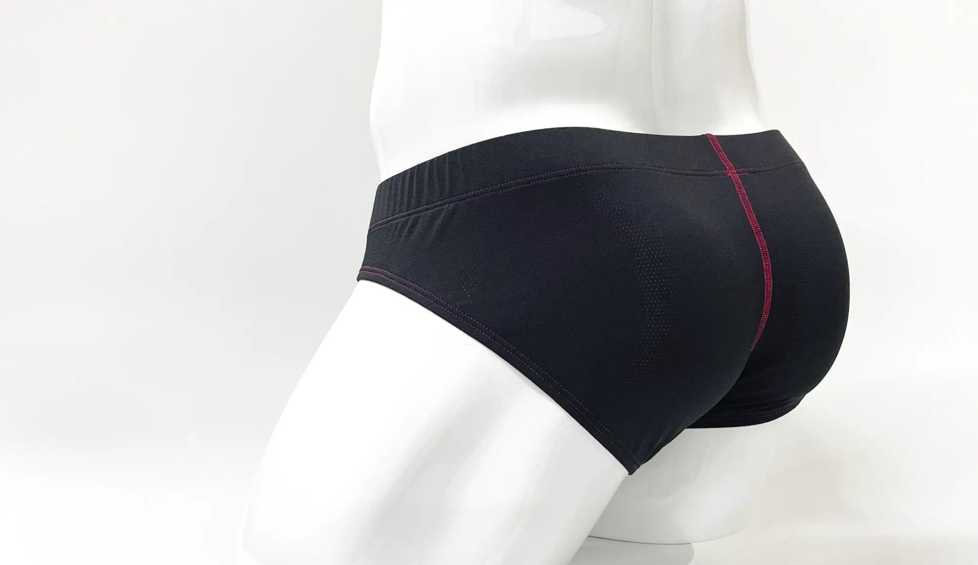 Wildmant stitch big boy pouch brief in black with subtle red stitching detail along the side seam