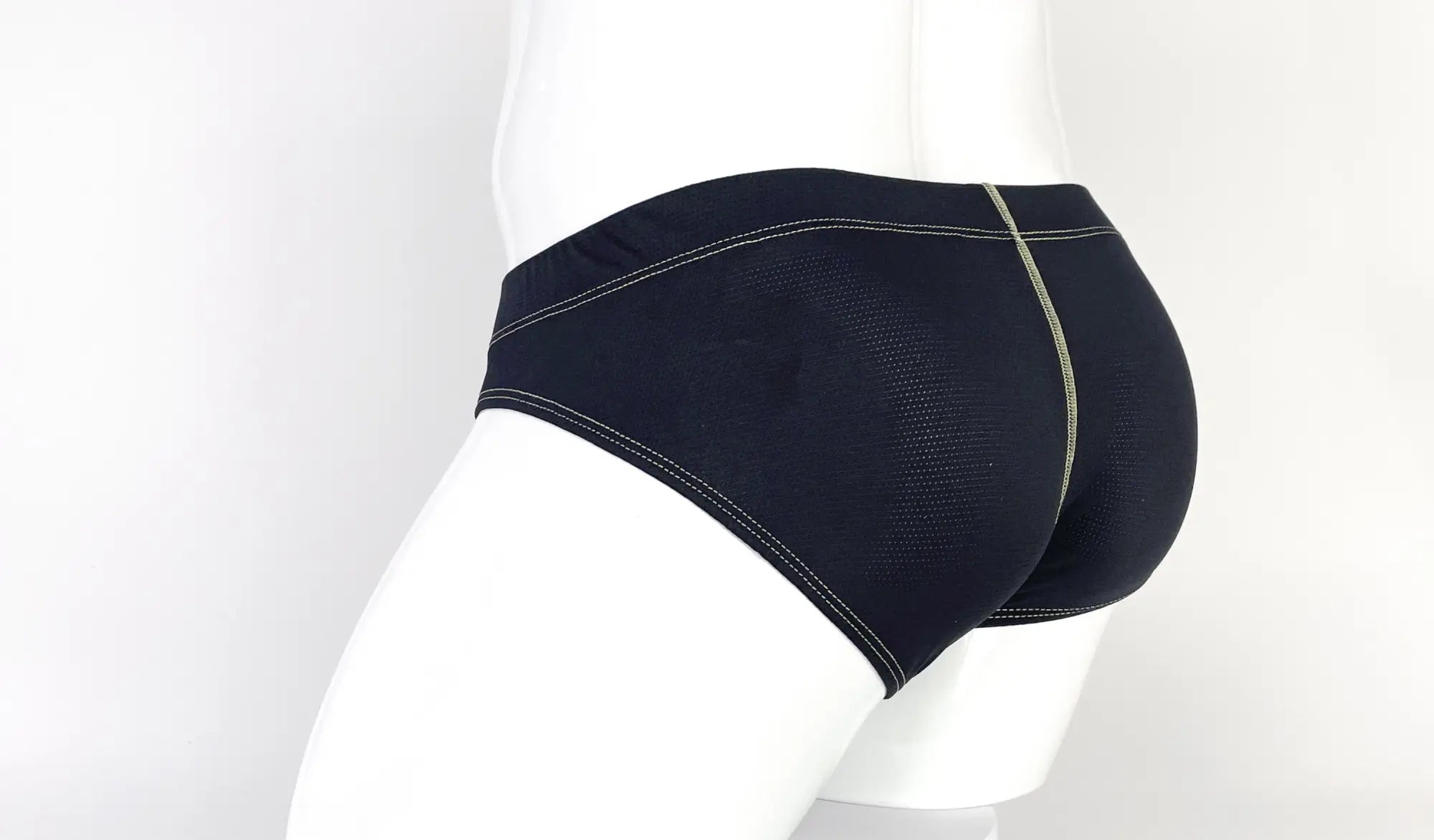 Wildmant stitch big boy pouch brief yellow in black with mesh panel and light green stitching for athletic support