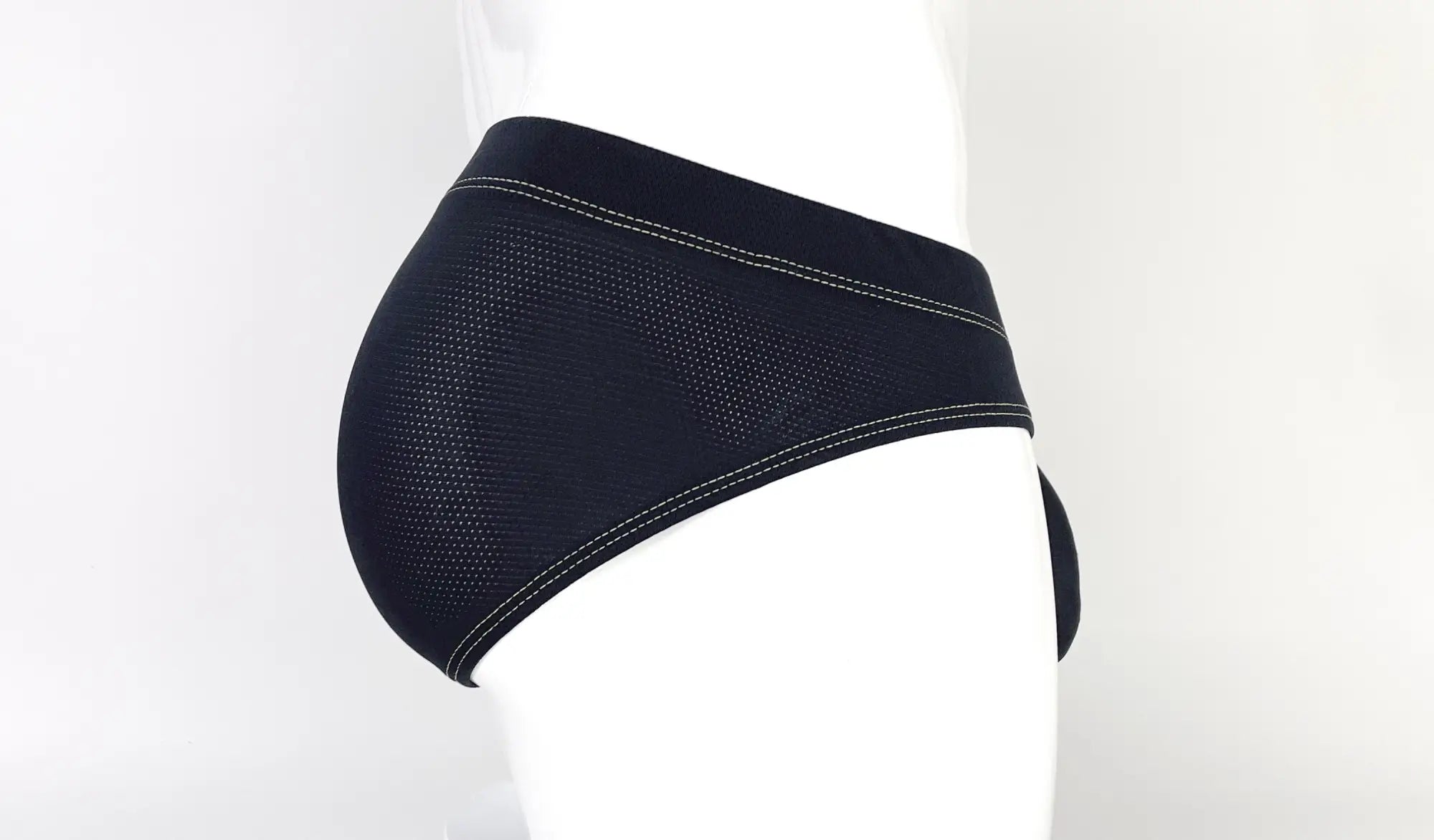 Wildmant stitch big boy pouch brief yellow featuring black mesh fabric with white stitching on waistband and leg openings