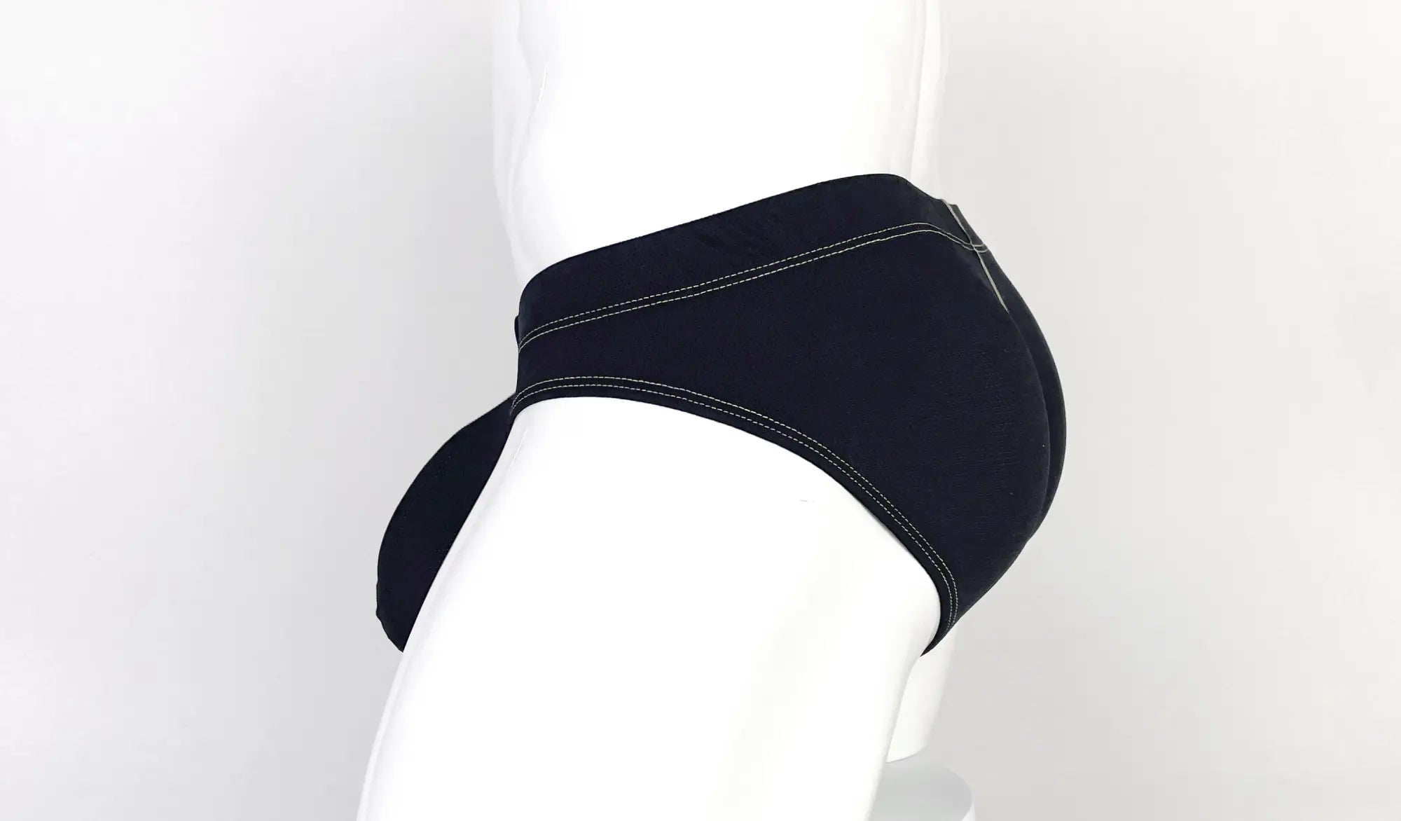 Wildmant stitch big boy pouch brief in black with yellow contrasting stitching and form-fitting underwear design