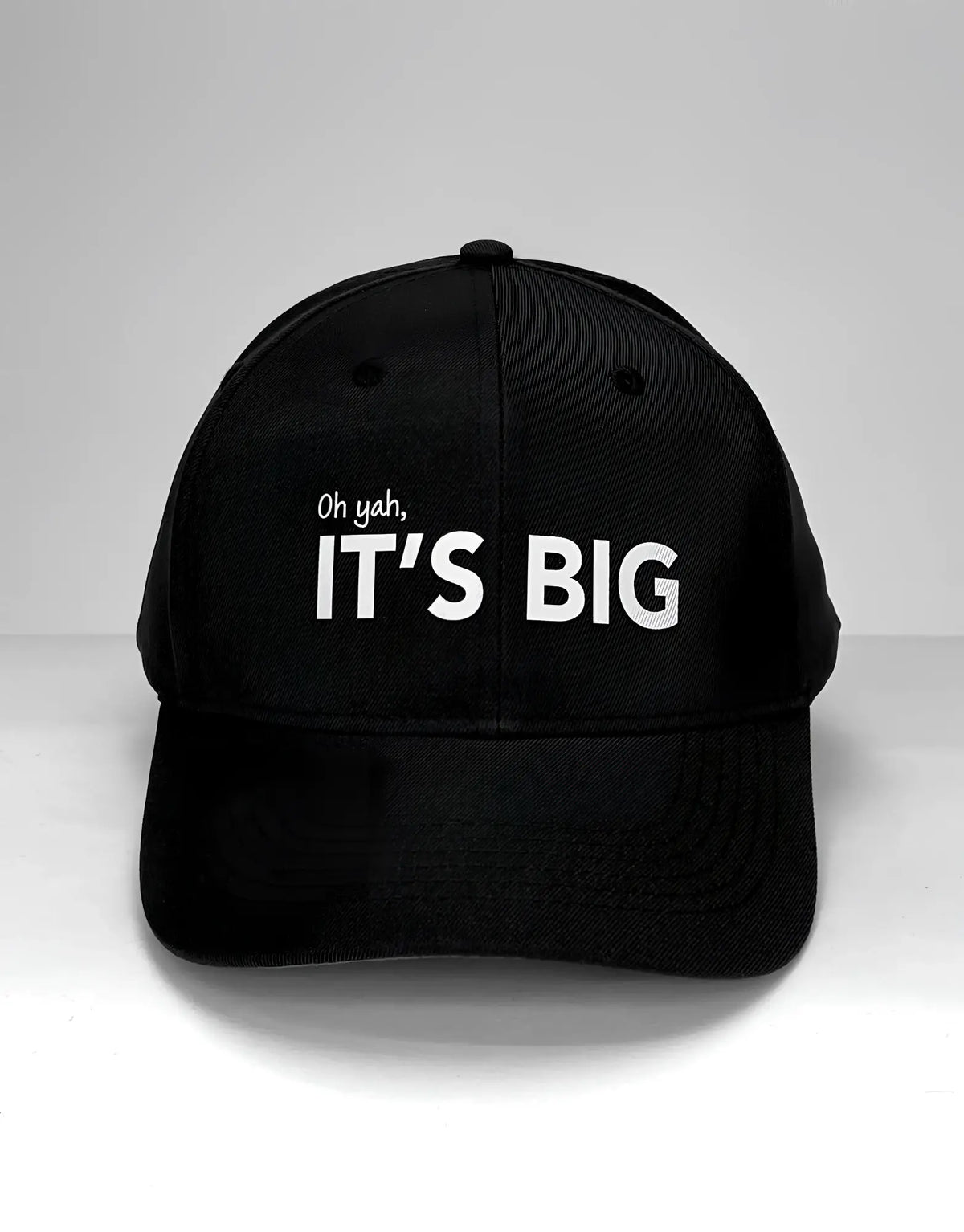 Black WildmanT Vanity Cap featuring white embroidered text oh yah its big on the front in a baseball cap style