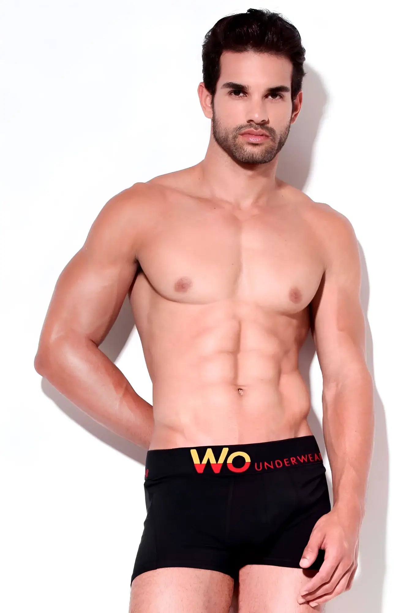 Wo Underwear solid black boxer briefs size M with bold yellow and red Wo Underwear logo on the waistband