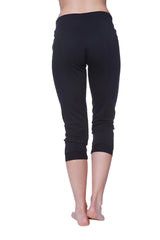 Black capri-length women’s yoga leggings with smooth stretchy fabric and elastic waistband in solid black