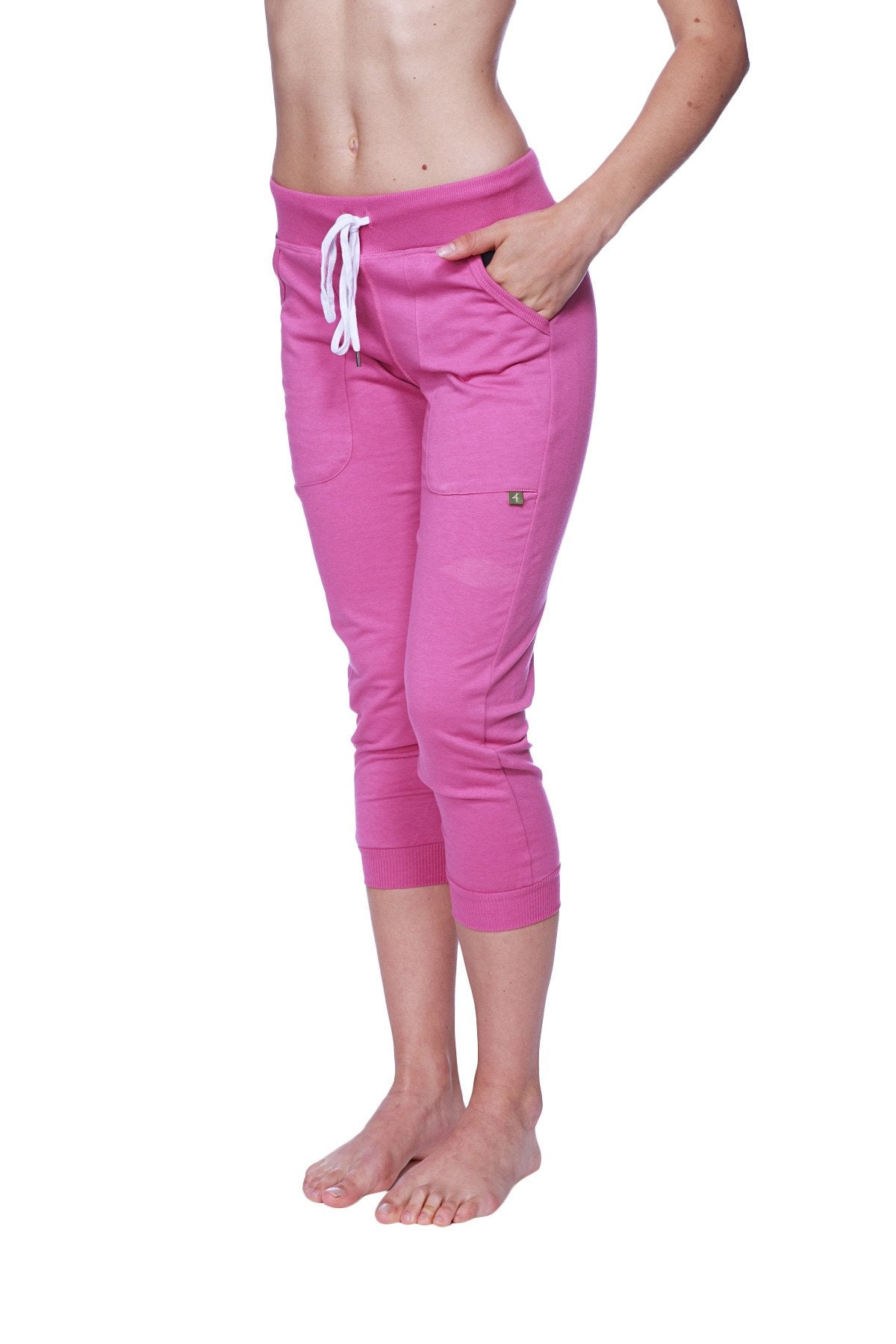 Women’s berry capri yoga pant with cuffed hem, white drawstring waistband, and side pockets in soft fabric