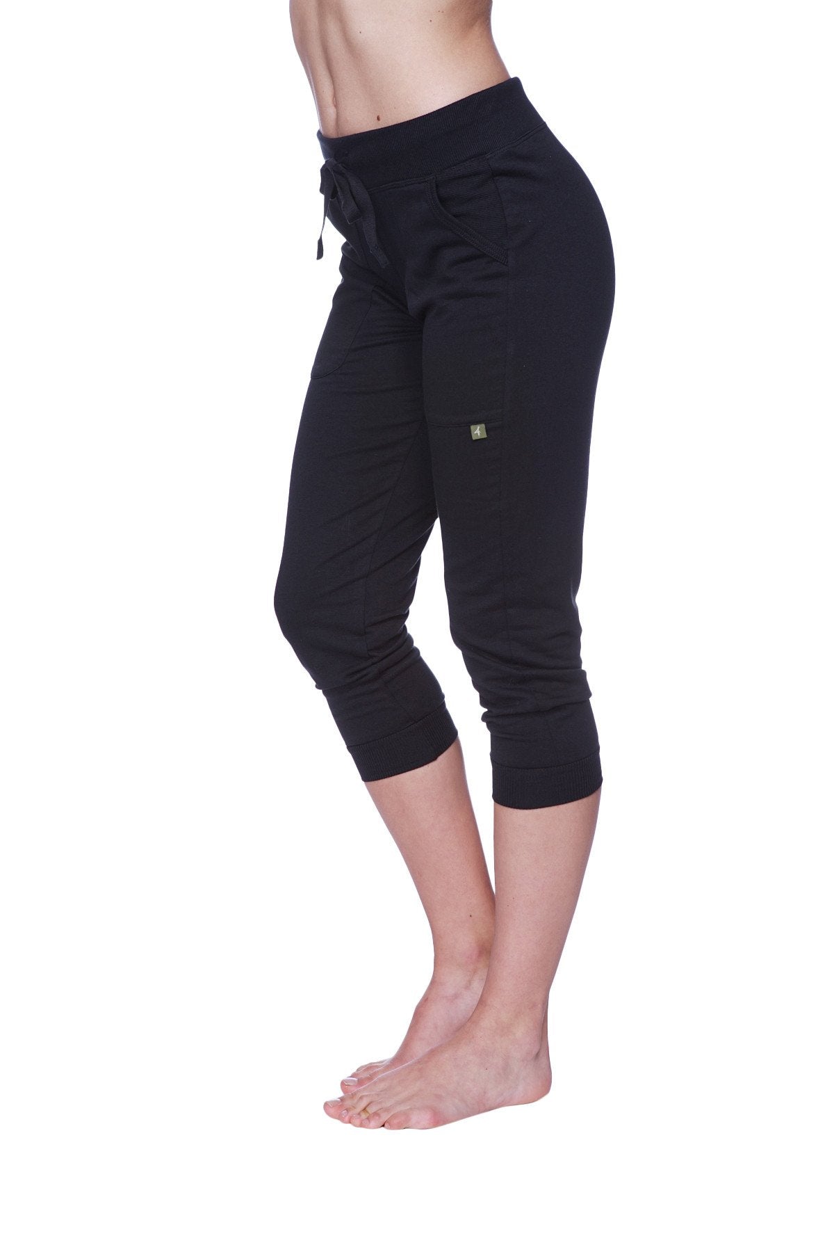 Women’s solid black 3/4 cuffed capri yoga pants with drawstring waistband and subtle side pockets