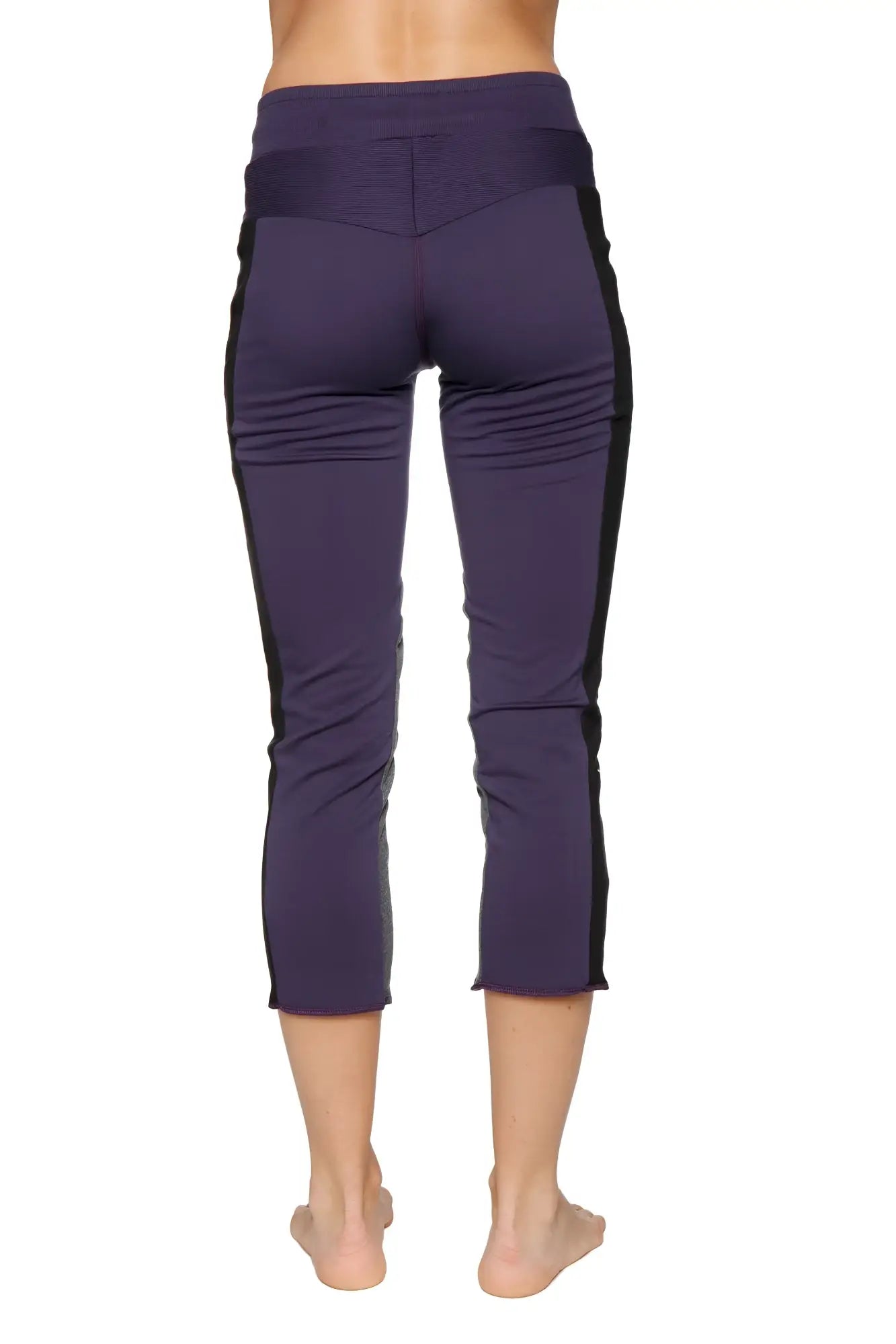 Women’s eggplant capri yoga leggings with black side panels high-waisted elastic waistband and zipper pocket