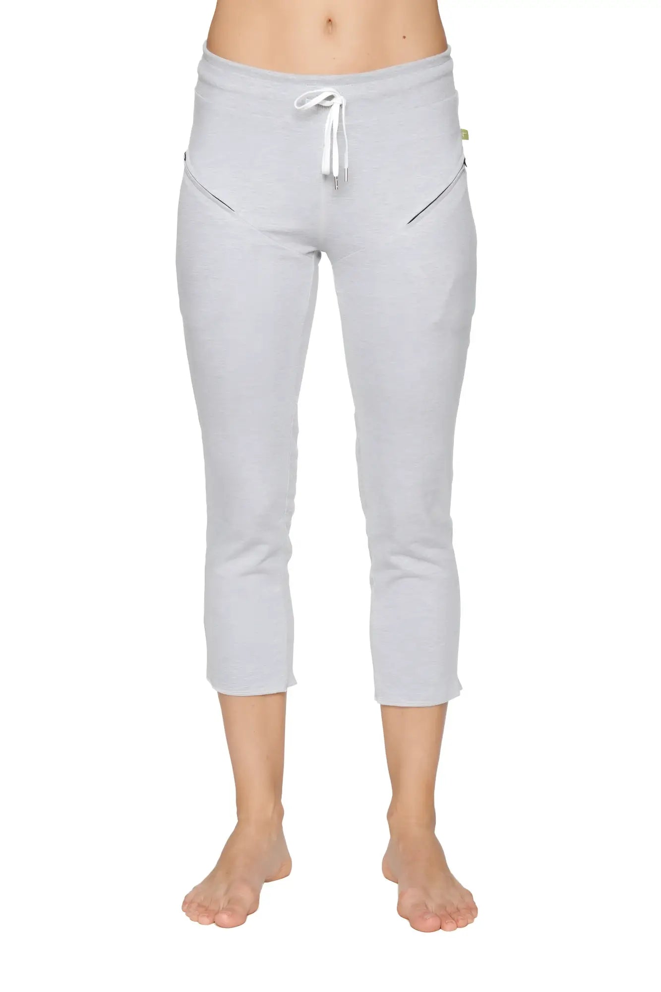 Light gray women’s 4/5 length capri yoga pant with white drawstring waistband and diagonal zipper pockets