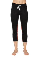 Women’s black capri yoga pants with red side stripes and white drawstring waistband featuring zipper pockets