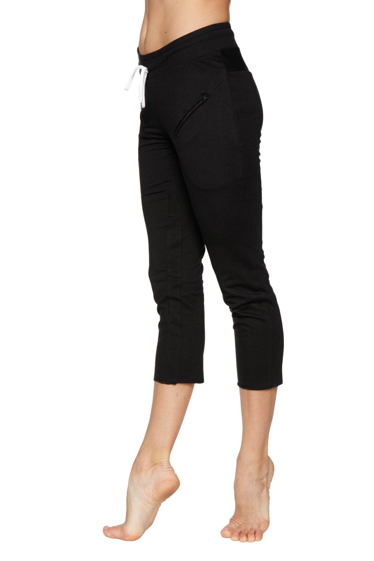Black capri-length yoga pants with high-waisted elastic band white drawstring and side zippered pockets for women