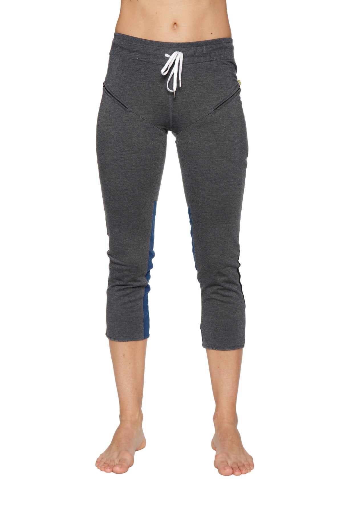 Women’s charcoal capri yoga pants with blue side panels, white drawstring waistband, and zipper pockets