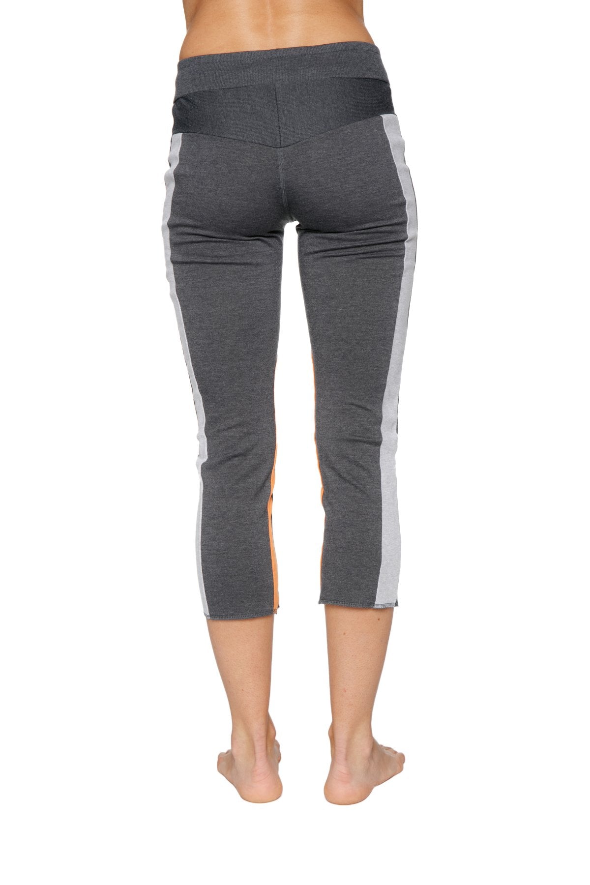Women’s charcoal capri yoga pant with white side stripes high waisted elastic band and zipper pocket