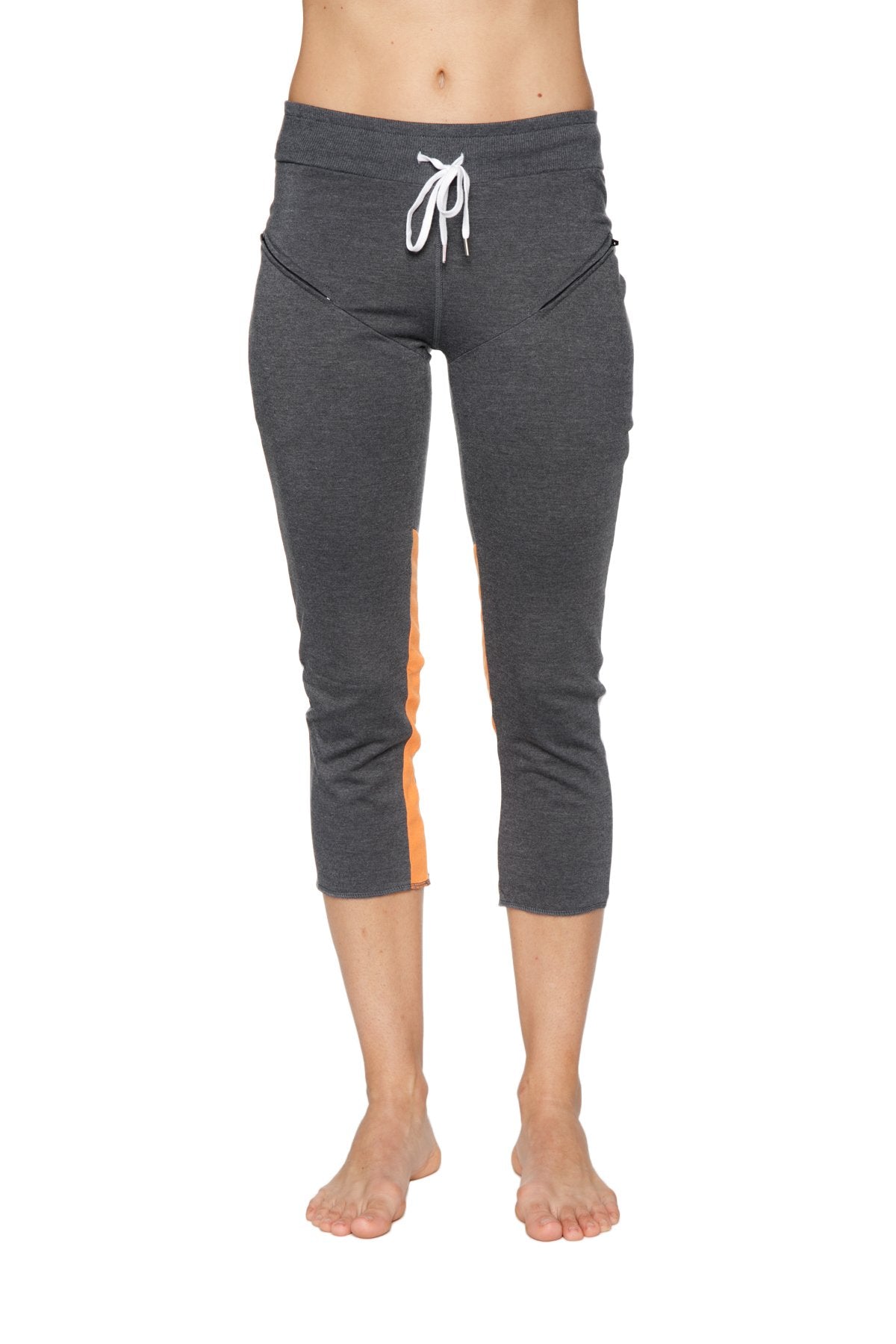 Women’s 4/5 length zipper pocket capri yoga pant in charcoal with grey heather and orange side panels with white drawstring waistband