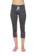 Women’s 4/5 length zipper pocket capri yoga pant in charcoal with grey heather and orange side panels with white drawstring waistband