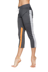 Women’s 4/5 length zipper pocket capri yoga pants in charcoal gray with orange accents and white drawstring waistband