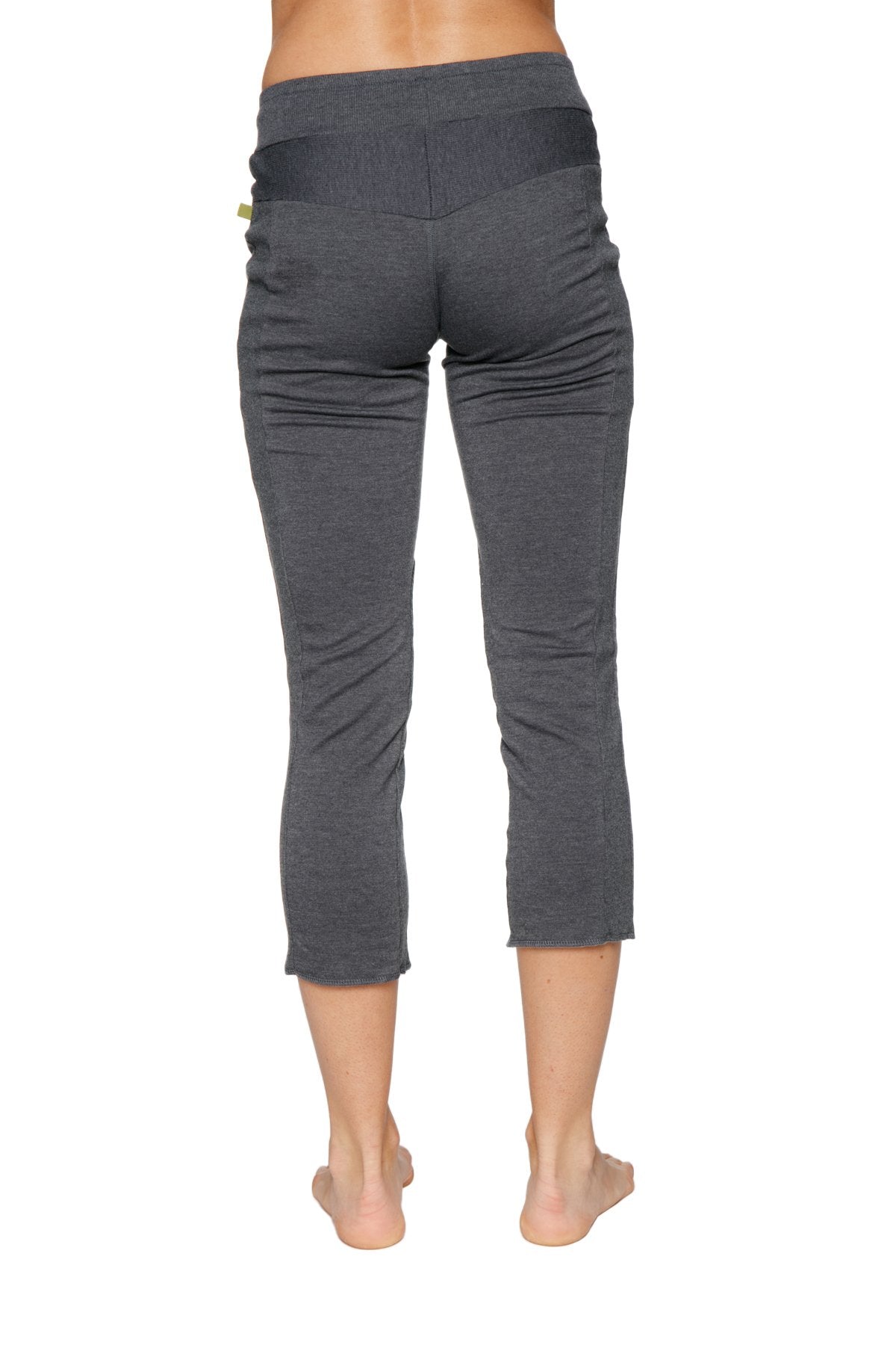 Dark gray soft-textured women’s 4/5 length zipper pocket capri yoga pants with black elastic waistband charcoal color