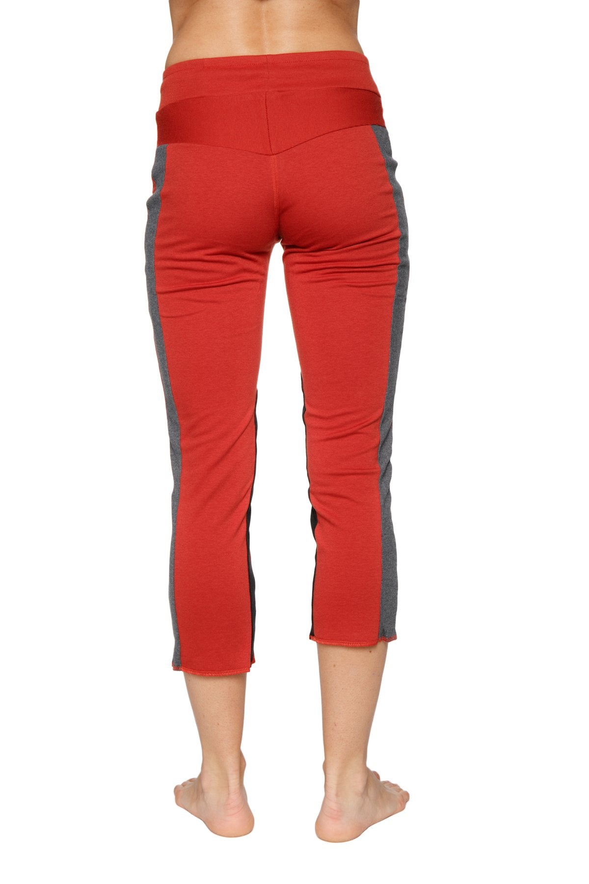 Women’s 4/5 length zipper pocket capri yoga pant in cinnabar with charcoal and black gray side panels and high waistband