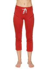 Women’s cinnabar red 4/5 length capri yoga pants with white drawstring waistband and diagonal zipper pockets