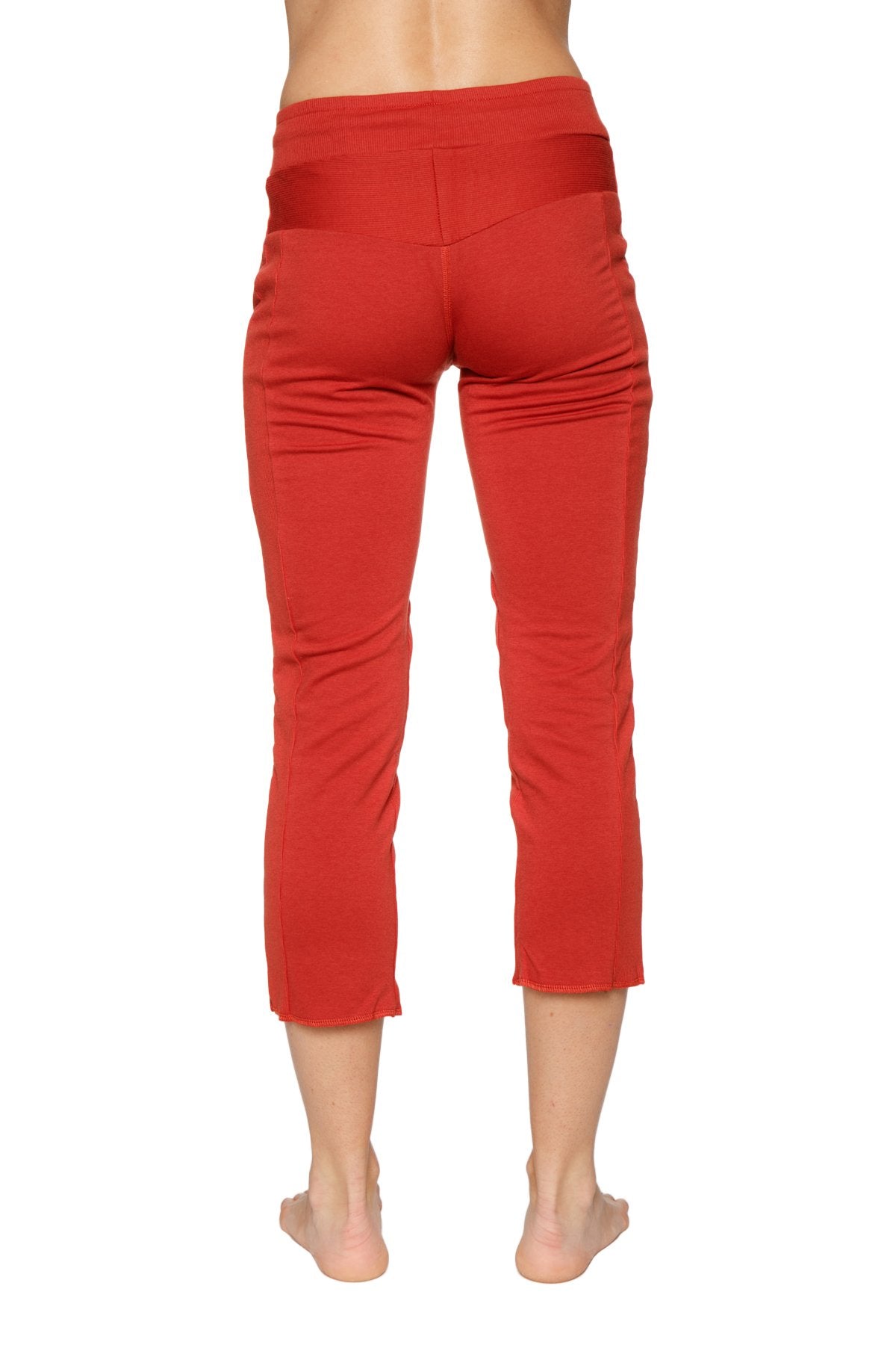 Women’s cinnabar red high-waisted 4/5 length zipper pocket capri yoga pants with smooth stretchy fabric
