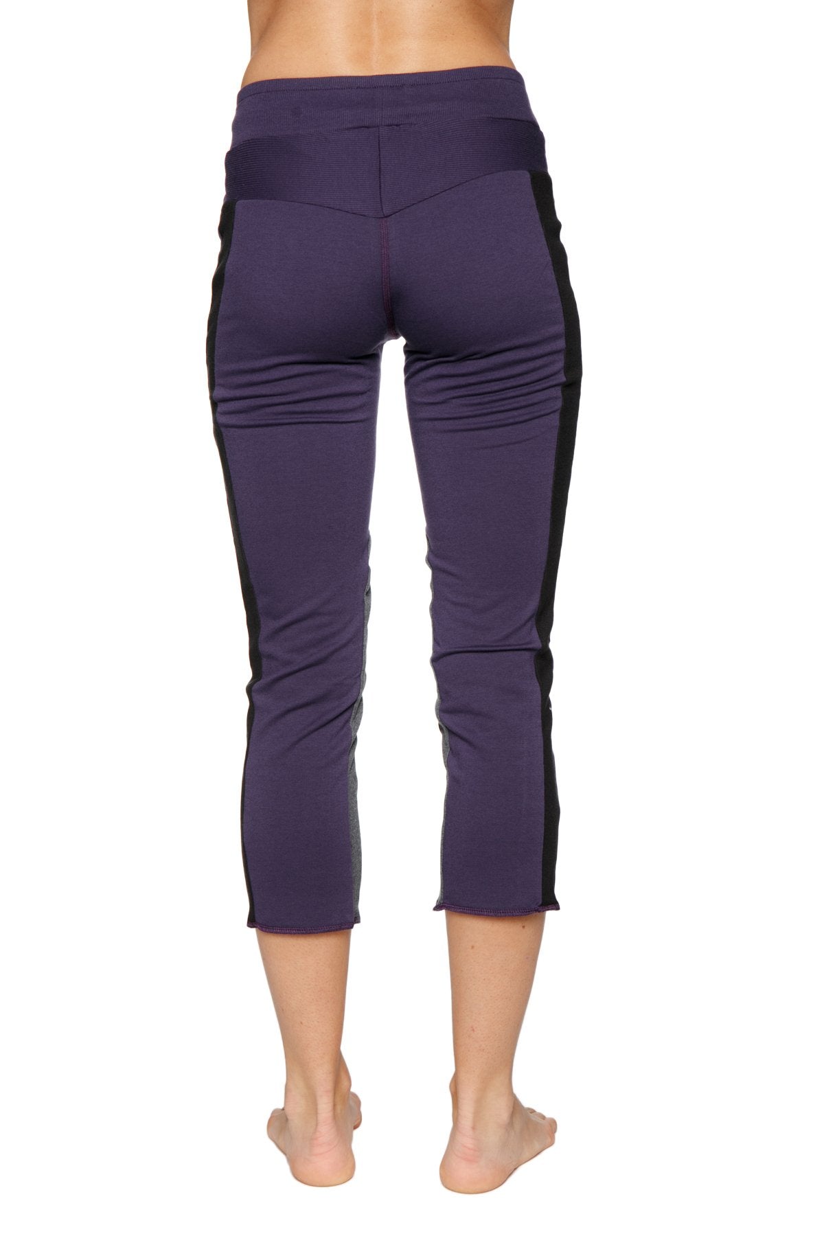 Women’s eggplant capri yoga leggings with black side panels high-waisted elastic waistband and zipper pocket