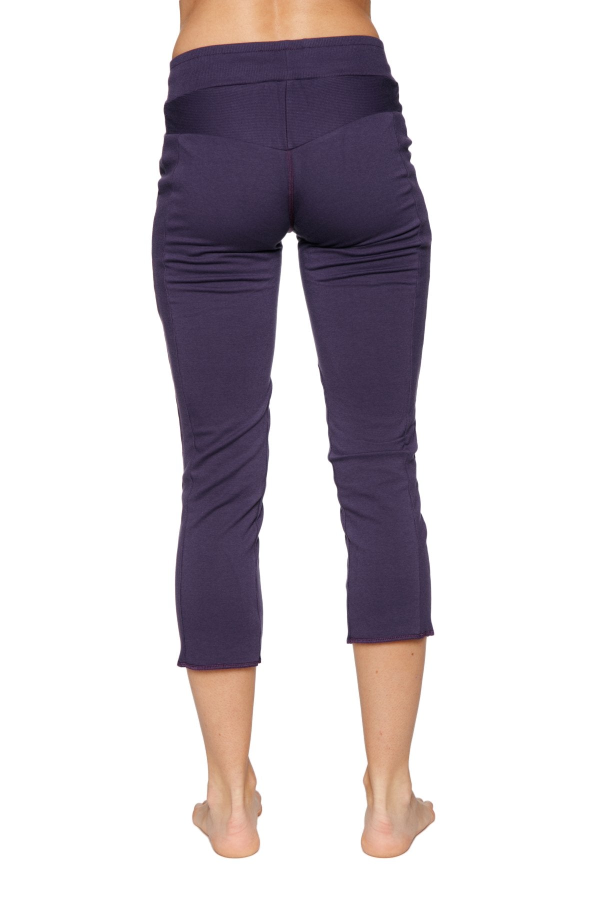 Women’s eggplant capri yoga pants with high-waisted elastic band and smooth stretchy fabric