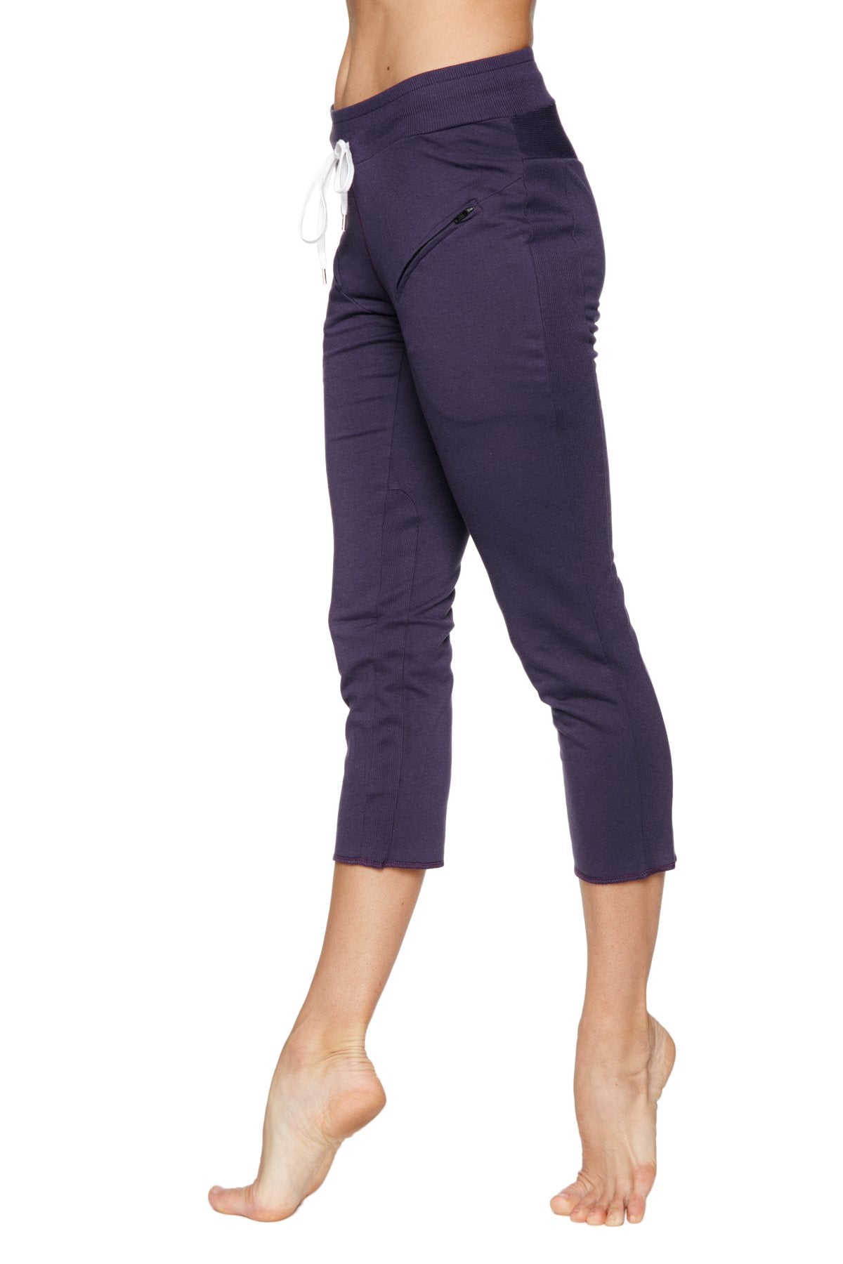 Women’s navy blue high-waisted 4/5 length zipper pocket capri yoga pants with white drawstring and side pockets