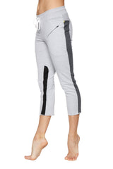 Women’s grey 4/5 length zipper pocket capri yoga pants with black and charcoal side stripes and white drawstring waistband