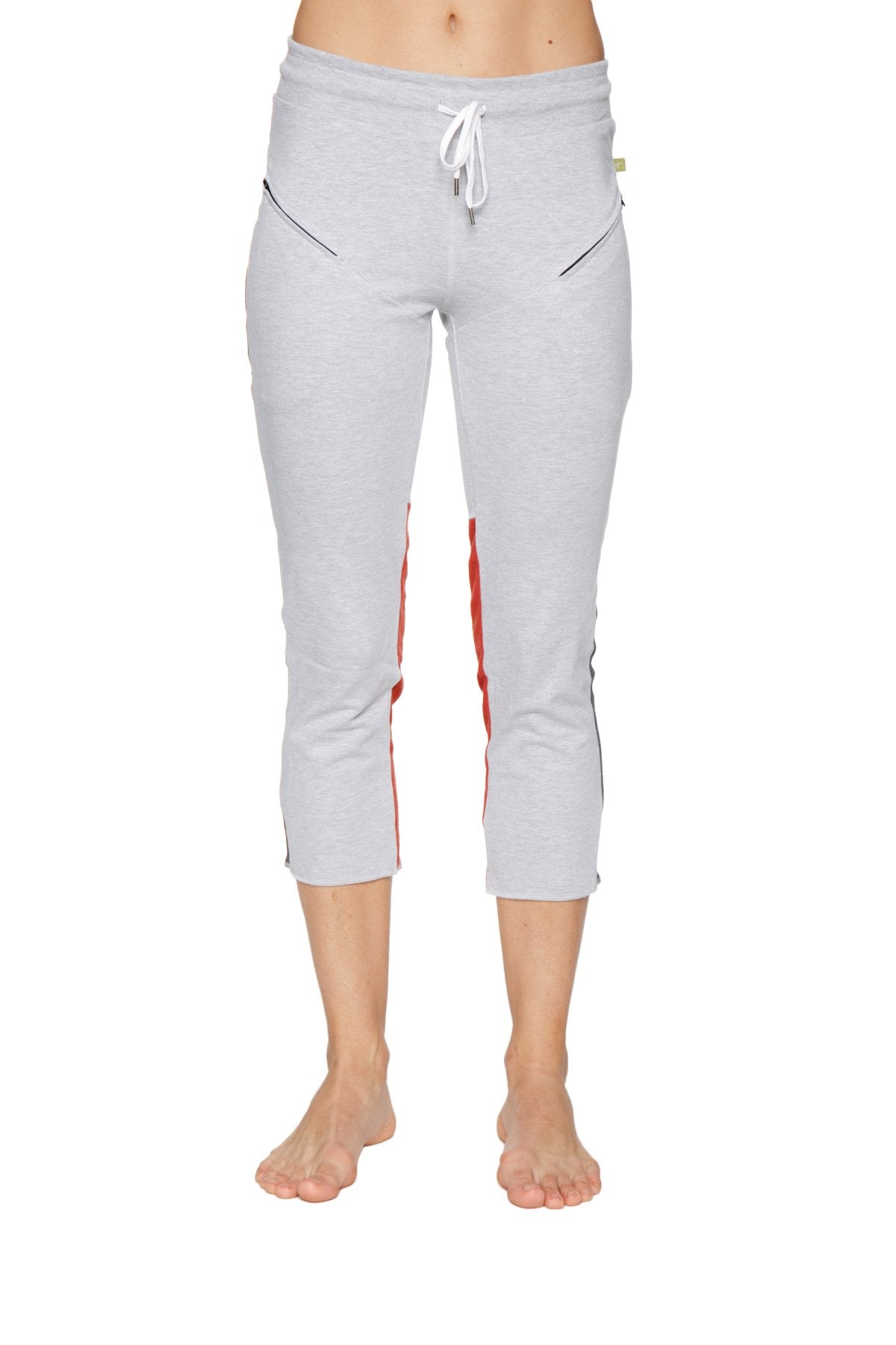 Women’s grey capri yoga pants with red and black side stripes and a white drawstring waistband