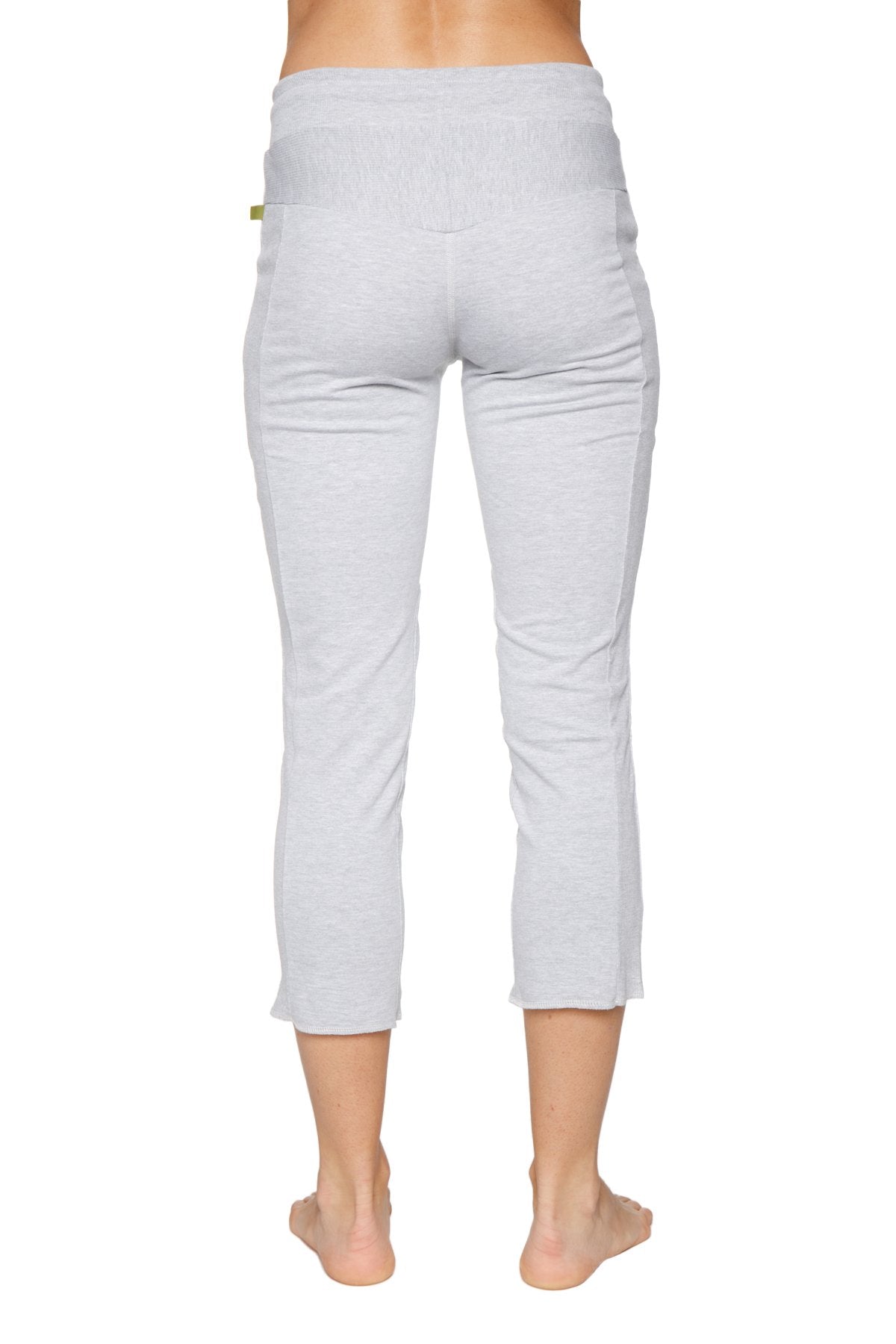 Back view of women’s heather grey soft capri yoga pants with ribbed waistband and zipper pocket detail