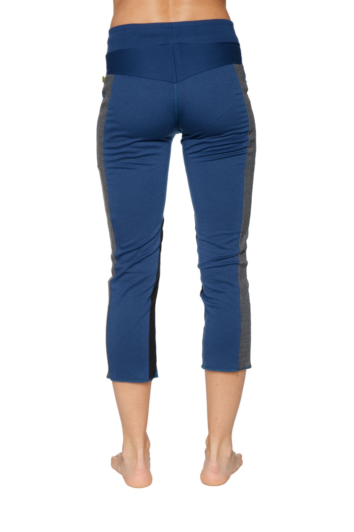 Women’s royal blue and charcoal high-waisted 4/5 length zipper pocket capri yoga pants for athletic wear