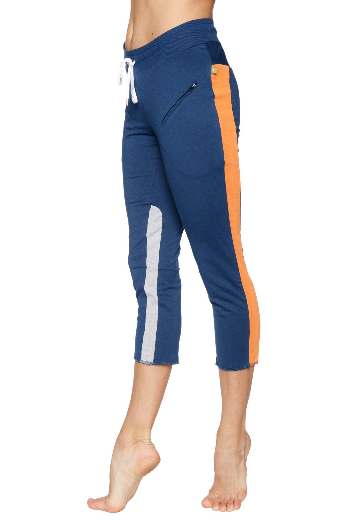 Women’s navy blue and orange 4/5 length zipper pocket capri yoga pants with white side stripe for active wear