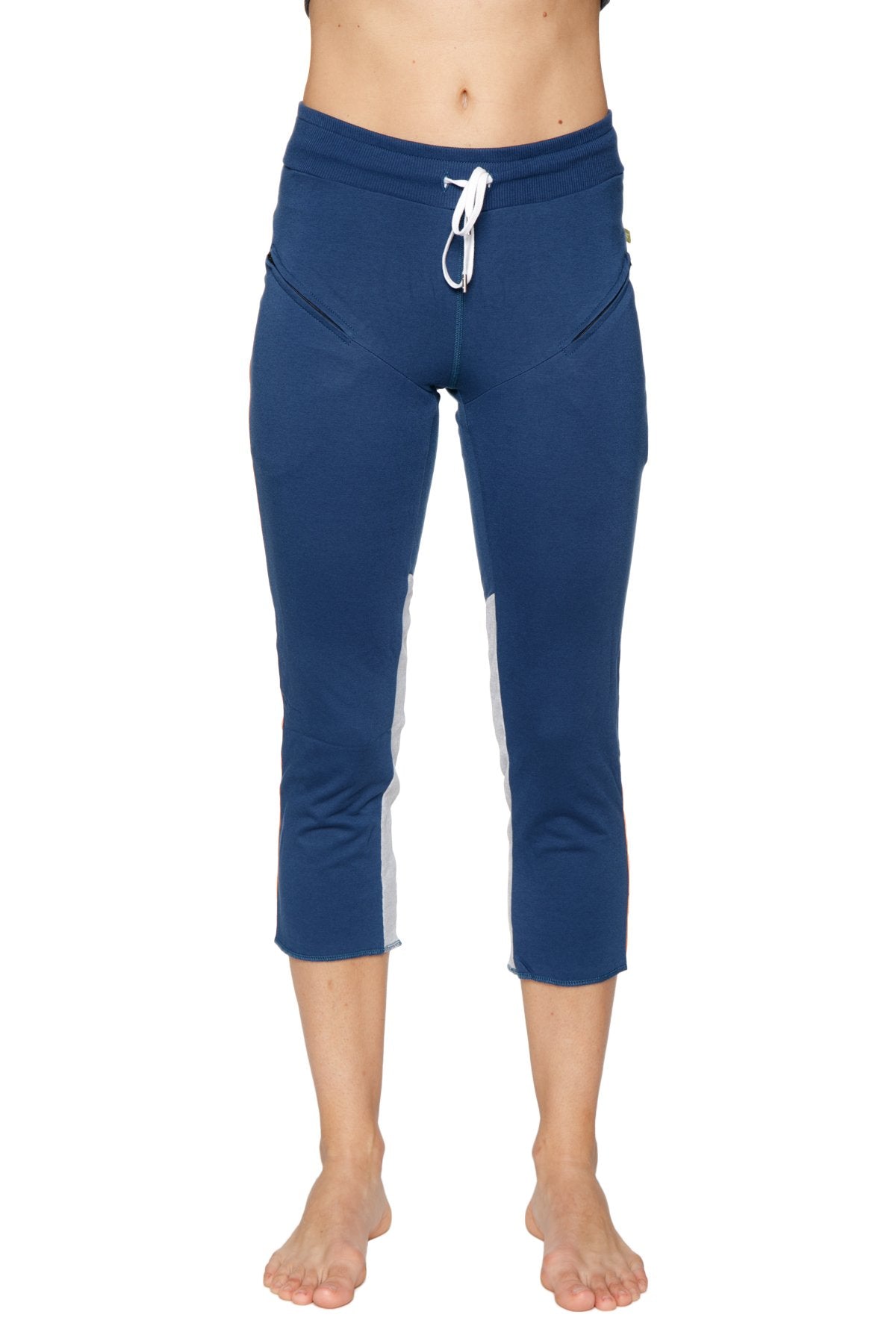 Women’s navy blue capri yoga pants with white side panels and drawstring waistband for activewear use