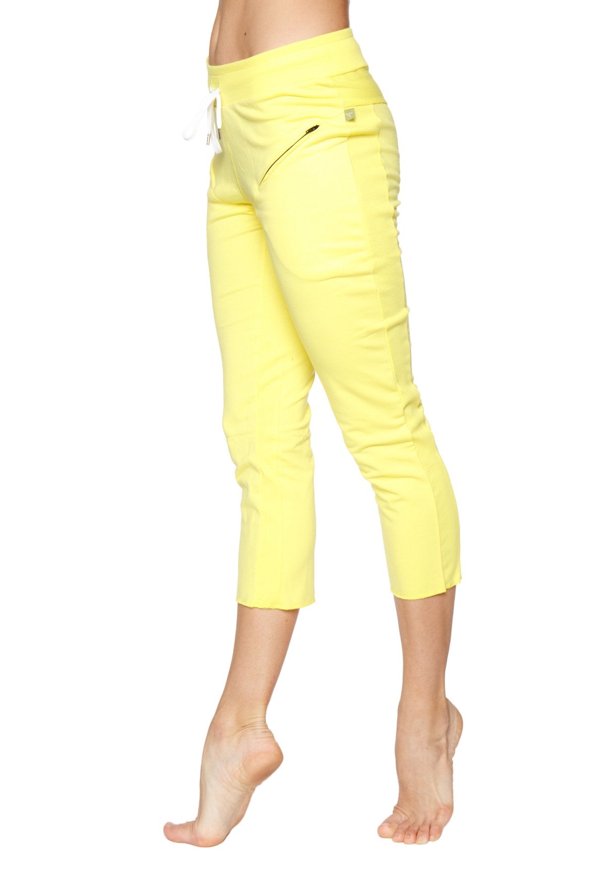 Bright yellow women’s 4/5 length zipper pocket capri yoga pants with high waist and white drawstring in tropic yellow