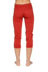 Women’s red cuffed jogger yoga pant with stretchy form-fitting fabric and subtle ruching at the lower legs