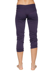 Women’s cuffed jogger yoga pant in navy blue with high-waisted elastic band and rolled cuffs made of stretchy fabric