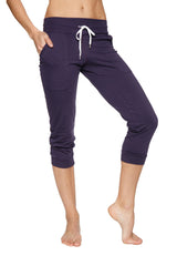 Women’s cuffed jogger yoga pant in navy blue with white drawstring waistband and elastic cuffs for comfort