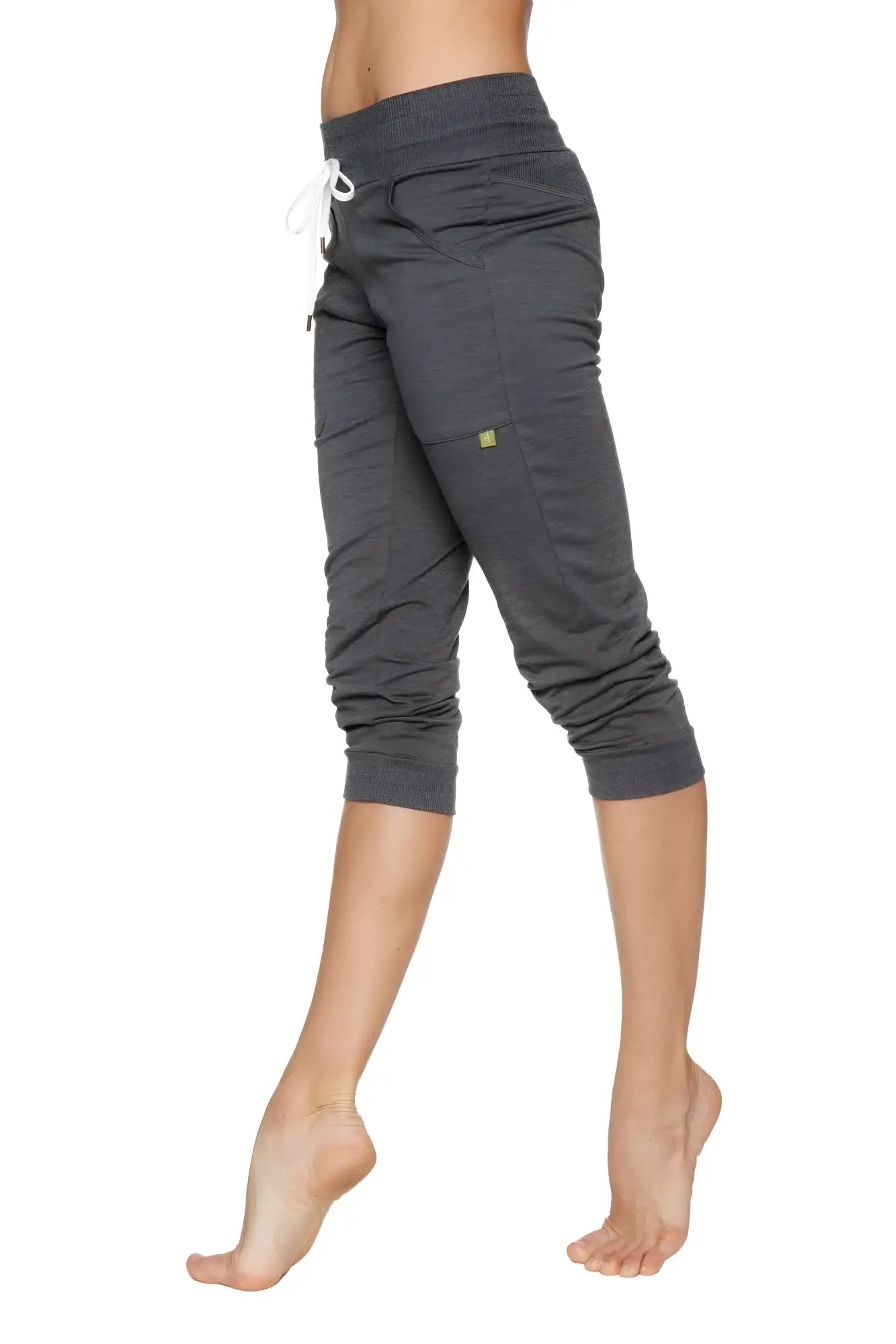 Dark gray cuffed jogger yoga pant with white drawstring waistband and elastic cuffs for women in solid charcoal