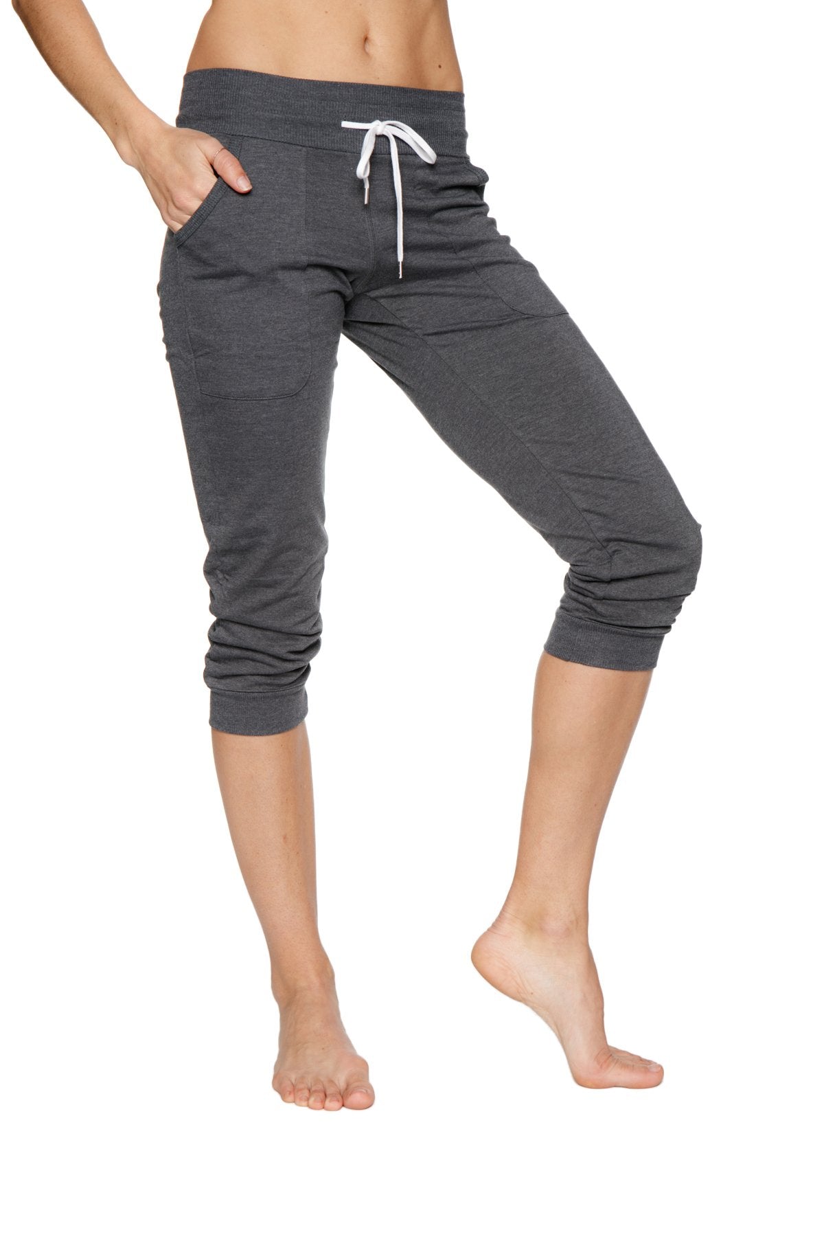 Women’s cuffed jogger yoga pants in solid charcoal with white drawstring waistband and elastic cuffs in dark gray