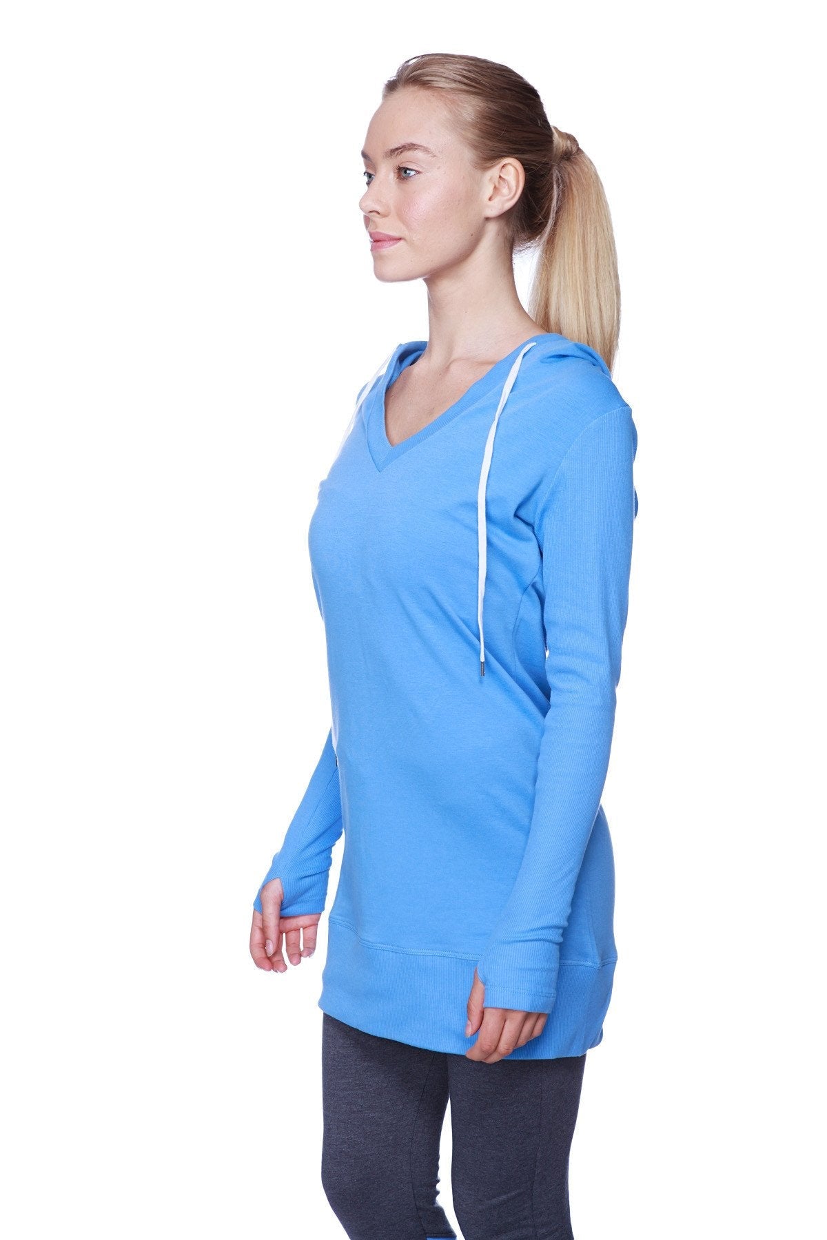 A vibrant ice blue women’s long body hoodie top with royal blue v-neck and white drawstrings long sleeves