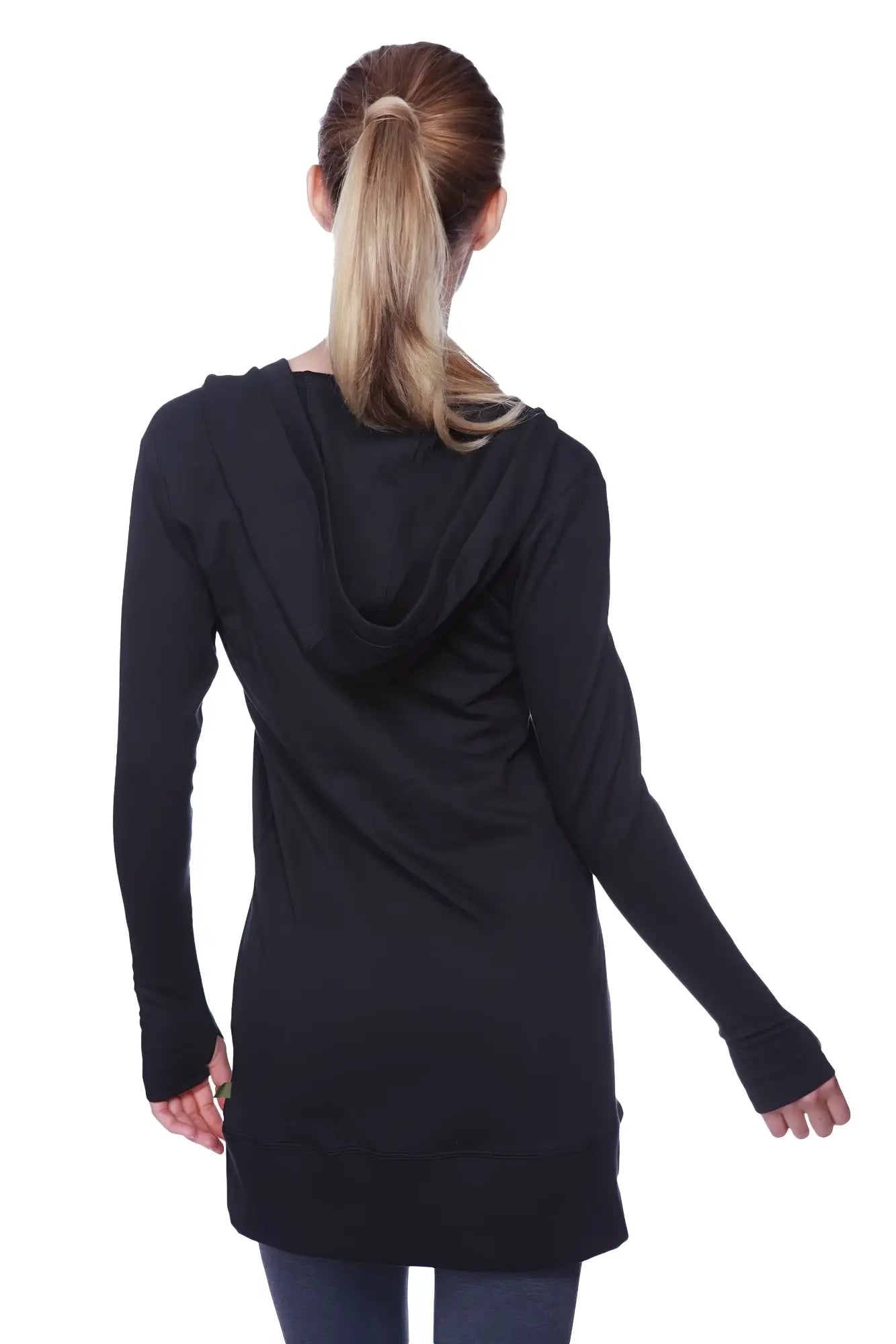 Women’s long body hoodie top in solid black with relaxed fit and ribbed cuffs made from soft fabric