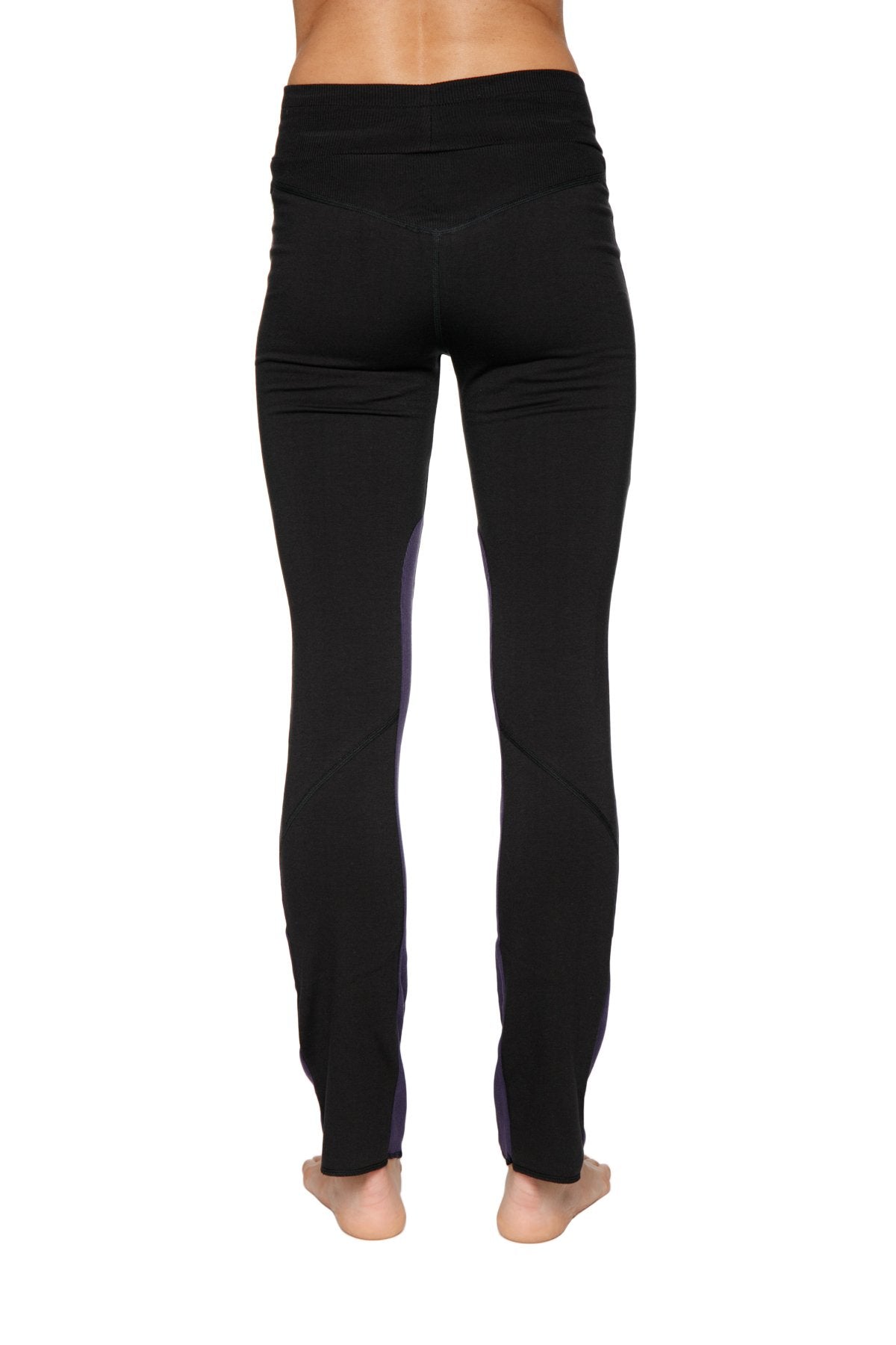 Women’s organic boyfriend yoga training pant in black high-waisted leggings with subtle purple side panels