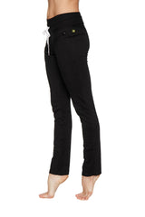 Women’s organic boyfriend yoga training pant in black high-waisted design with white drawstring and green brand tag