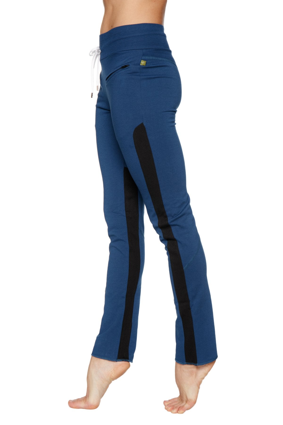 Women’s organic boyfriend yoga training pant in blue with black side stripes and white drawstring waistband