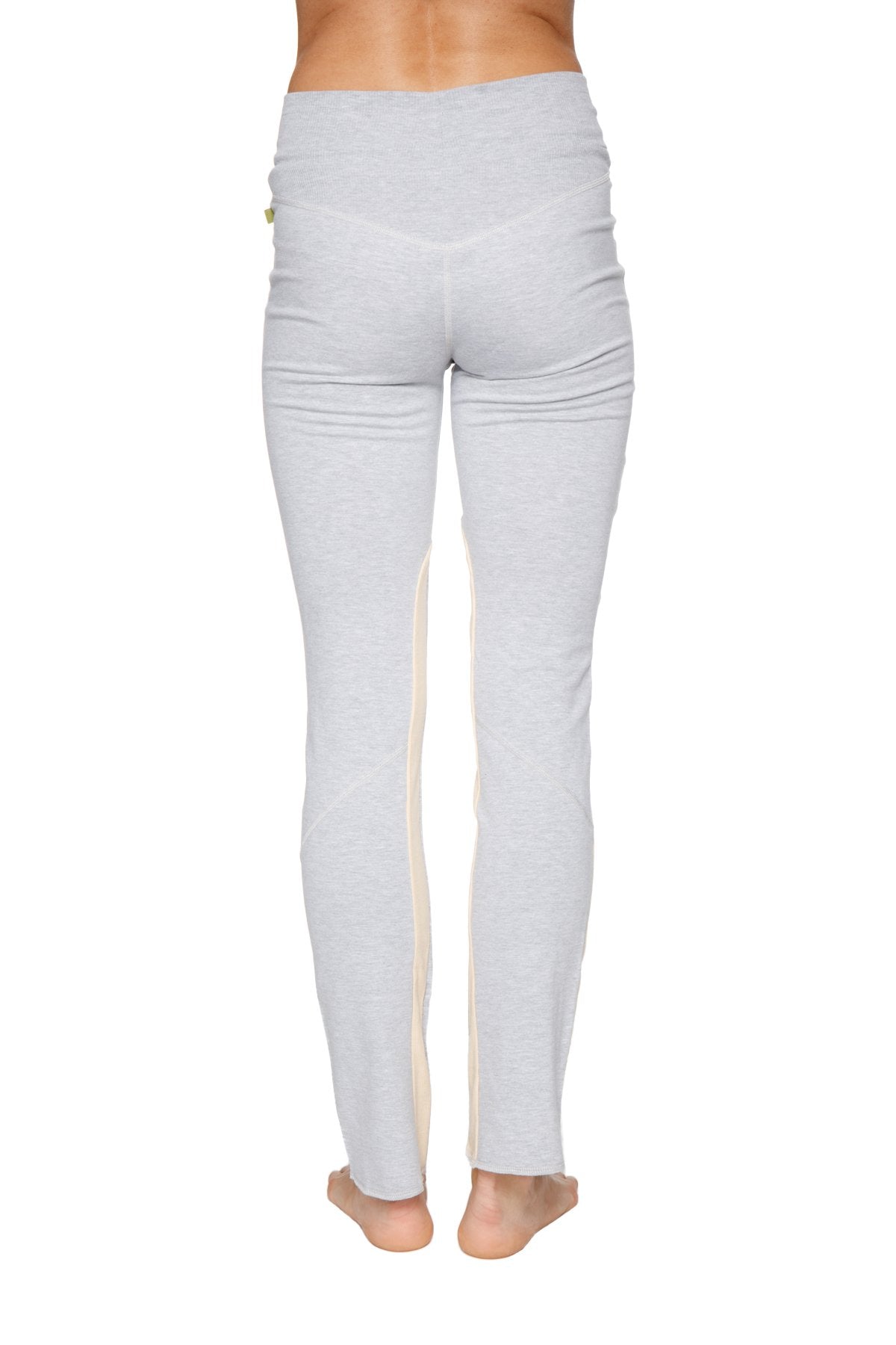 Women’s organic boyfriend yoga training pant in light gray with subtle vertical seam detail on the outer leg