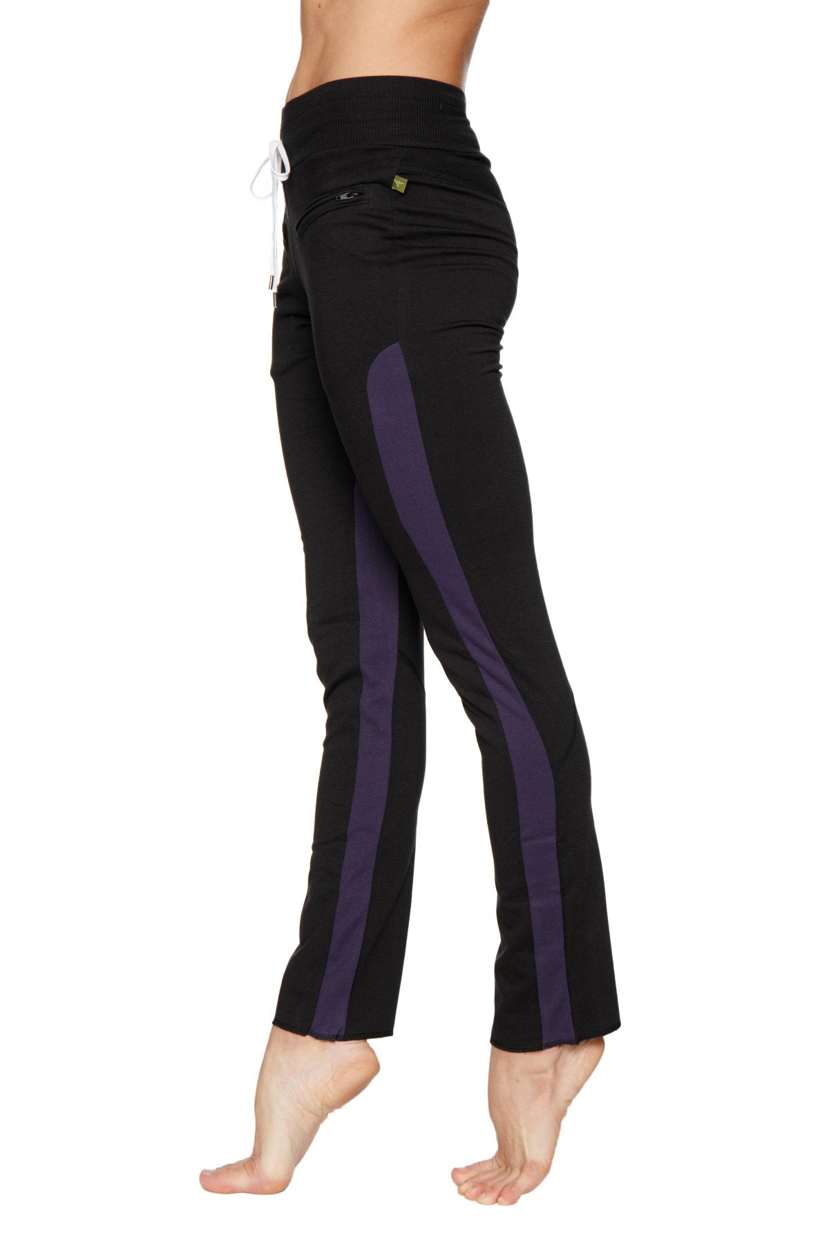 Women’s organic boyfriend yoga training pant in black with purple side stripes and white drawstring waistband