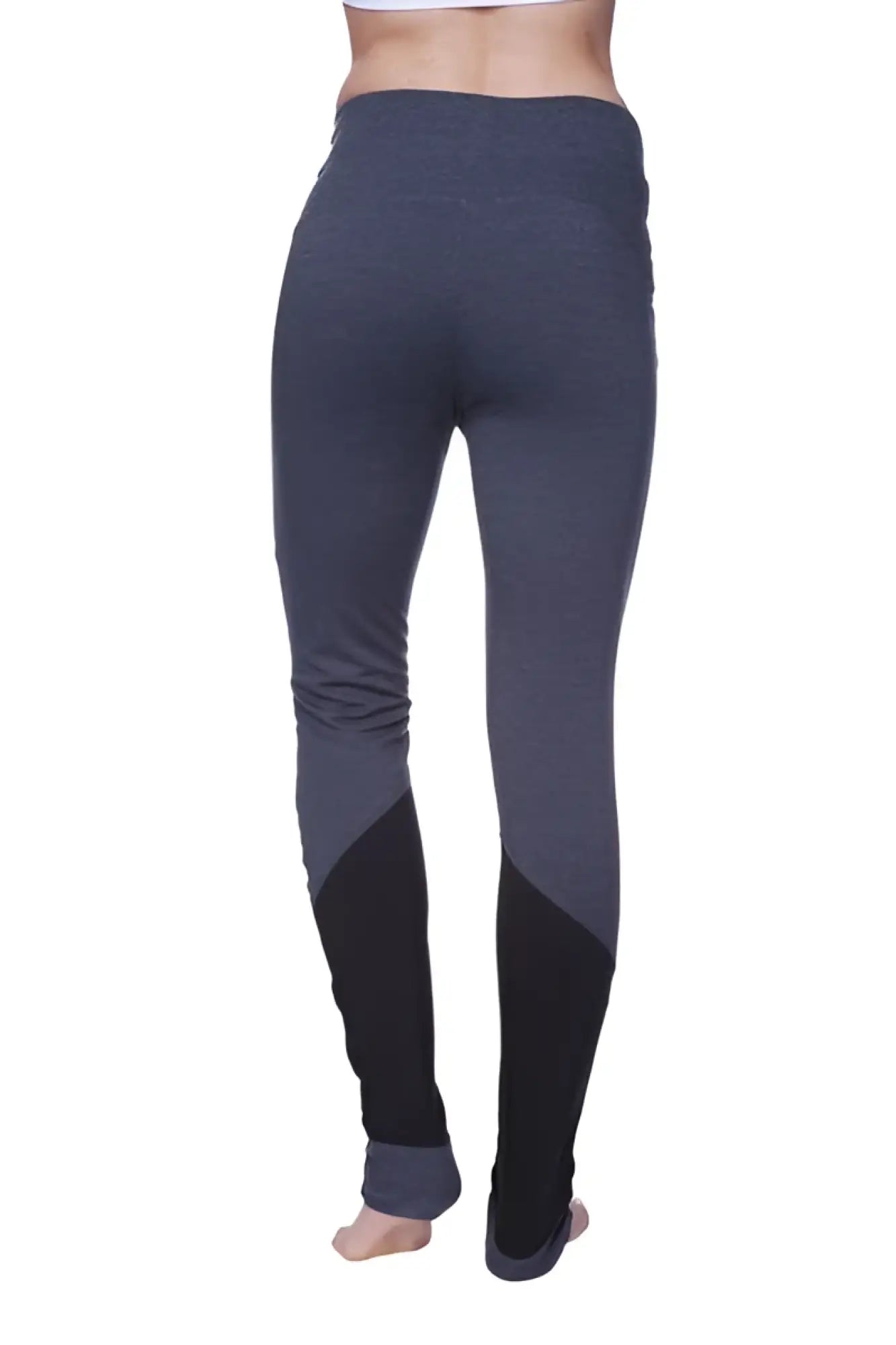 Women’s performance yoga pant in dark gray and black with snug fit and contrasting lower leg panels