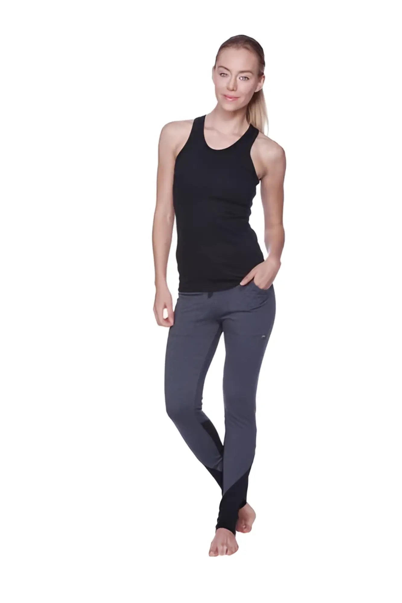 Dark gray women’s performance yoga pant with form-fitting athletic cut and subtle thigh branding in smooth fabric