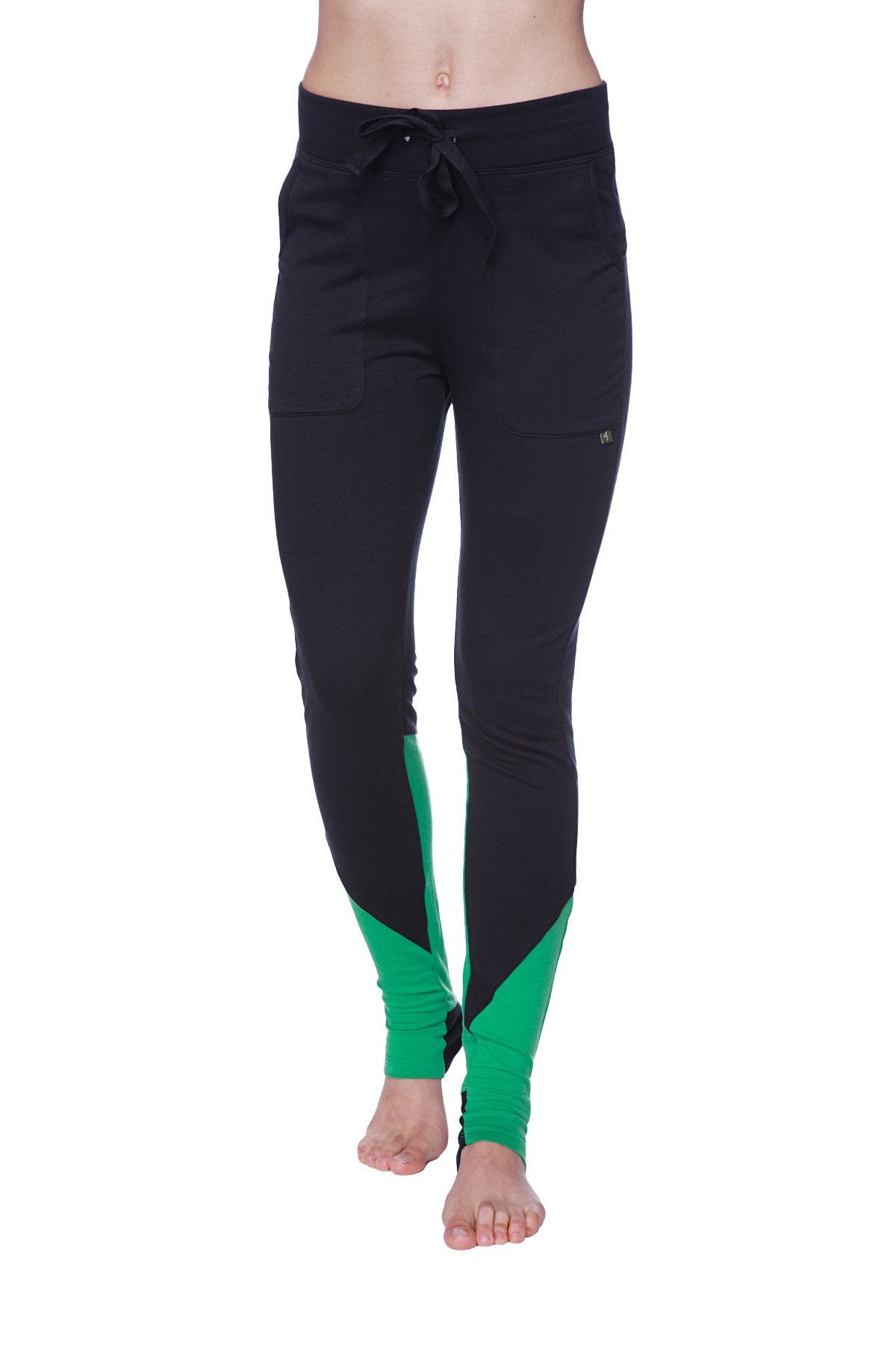 Women’s performance yoga pant in black and green with a drawstring waistband designed for athletic wear