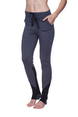 Women’s performance yoga pant in dark gray and black with drawstring waistband, side pockets, and thigh panels