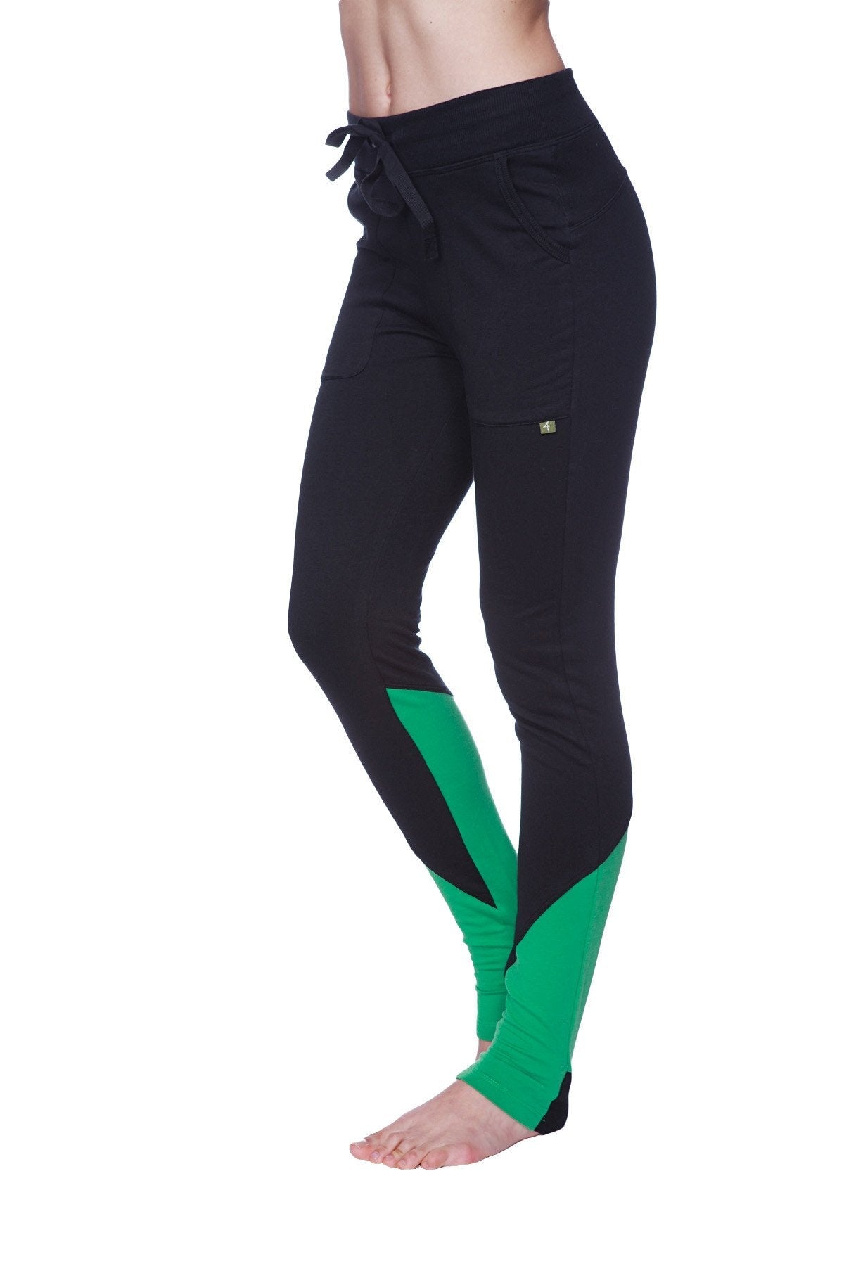 Women’s performance yoga pant in black and green with a drawstring waistband for athletic use