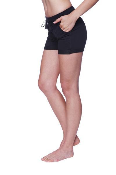 Women’s performance yoga shorts in black with a relaxed fit drawstring waist and side pockets for comfort